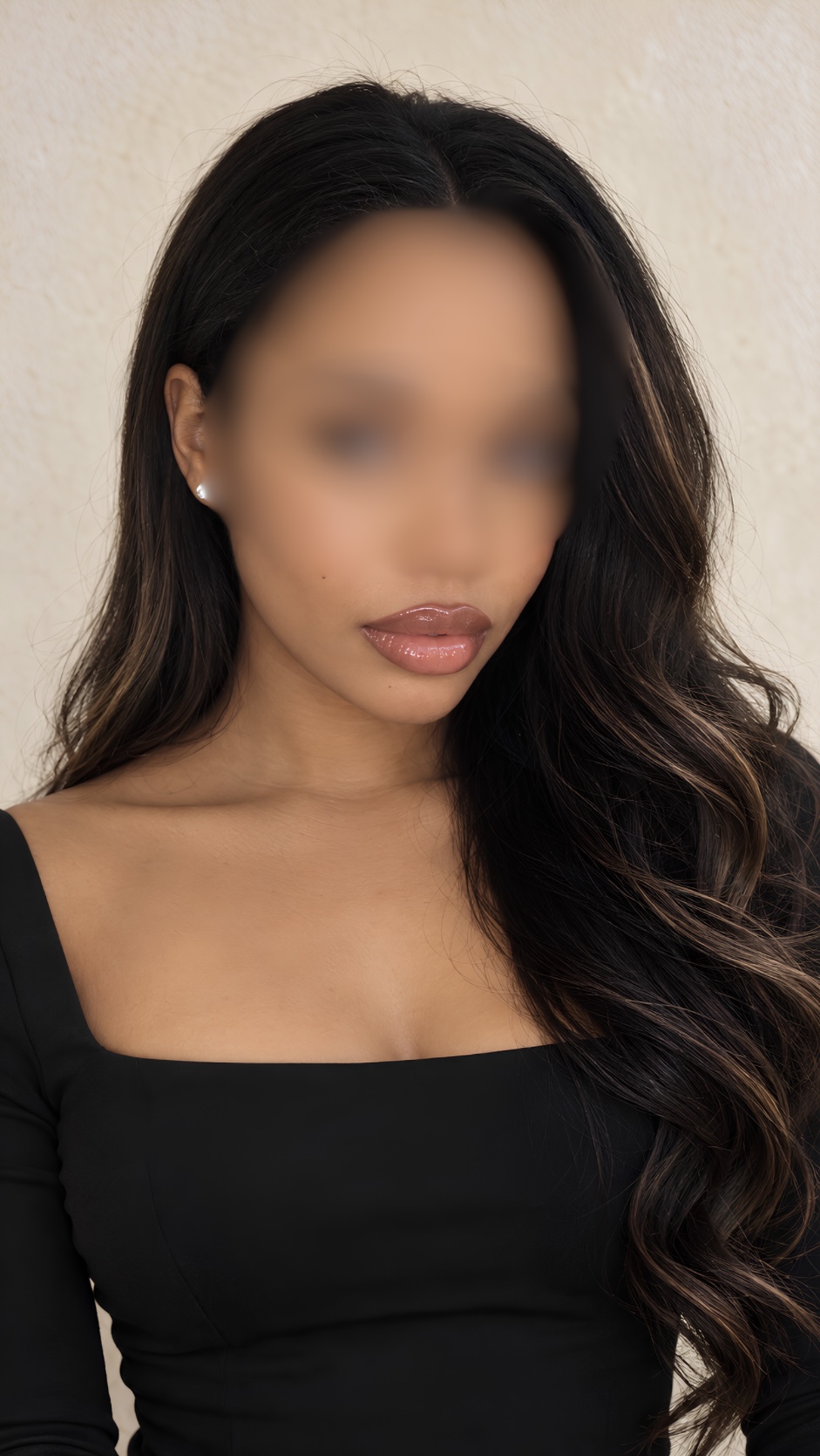 A close-up of Milani in a black dress